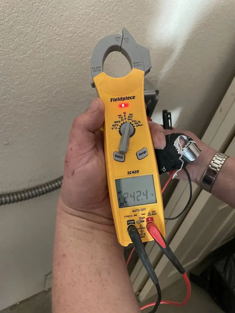 Voltage testing with clamp meter during Electrical Installation Services in Neptune